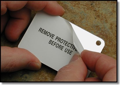 Rescue Flash (tm)  Signal Mirror Removing Protective Covering